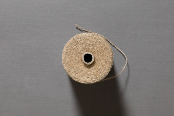 Linen String isolated on a gray background. Spool of twine.High-resolution photo. - Photo, Image