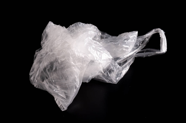 white plastic Bag on black background - Fotó, kép