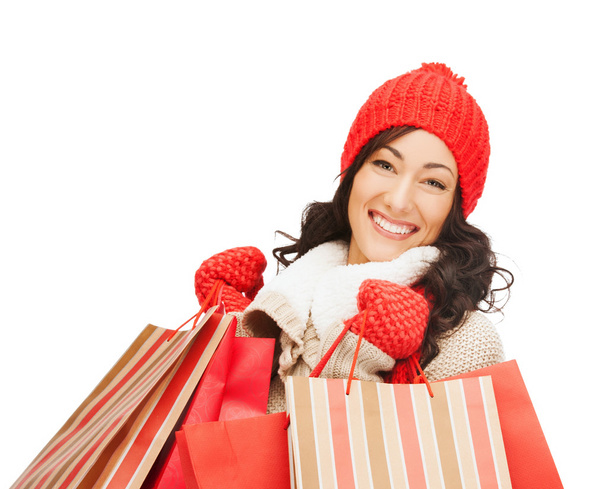 Smiling woman in warm clothers with shopping bags - Фото, зображення
