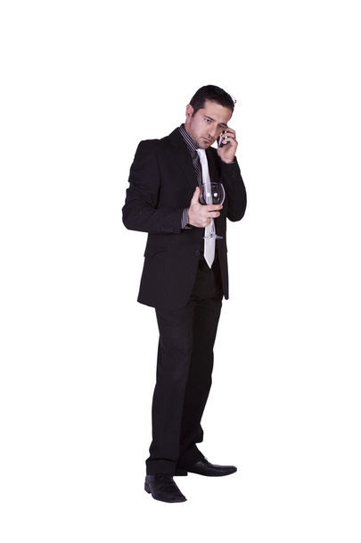 Businessman celebrating with a glass of drink - Фото, зображення