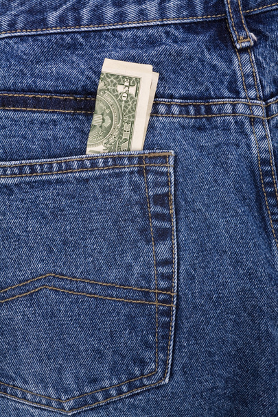 jean azul e dólares
 - Foto, Imagem