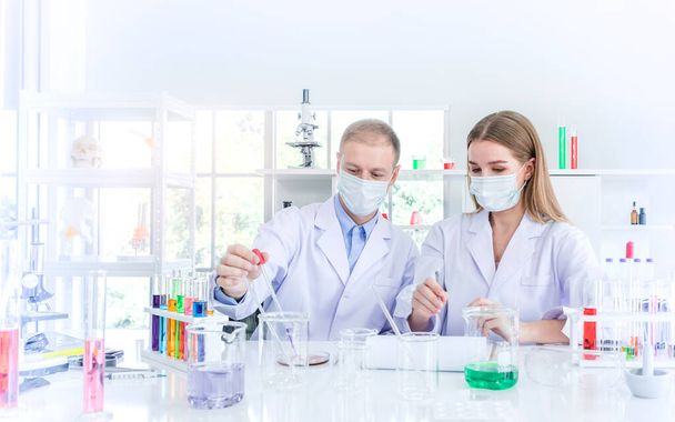 Scientists researching for some confidential in chemical laboratory, teamwork and scientist working concept - Fotoğraf, Görsel