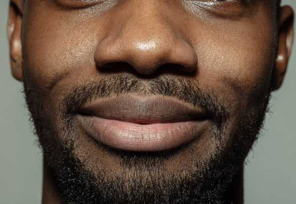 Close up of face of beautiful african-american young man, focus on mouth - Valokuva, kuva