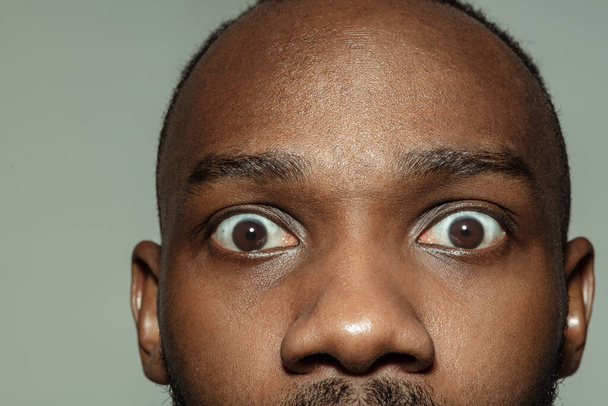 Close up of face of beautiful african-american young man, focus on eyes - Photo, image