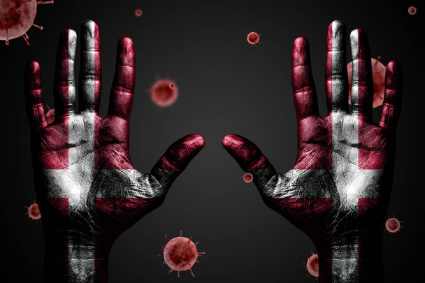 Danger concept from coronavirus, arms up with Denmark flag and flying bacteria Covid-19, on dark isolated background. - Photo, Image