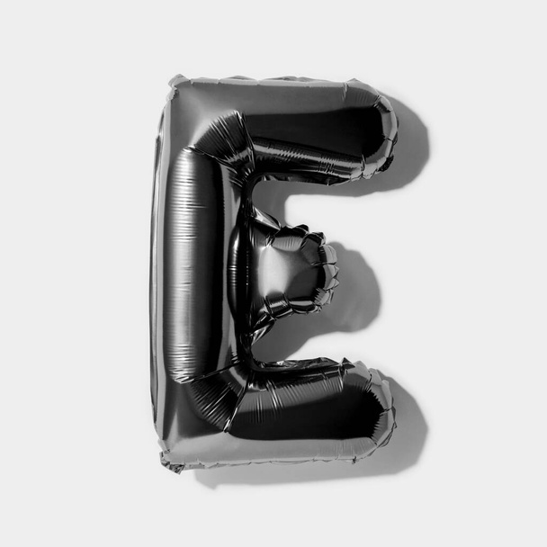 Letter E, Black foil balloon alphabet isolated on a white background with Clipping Path - Photo, image