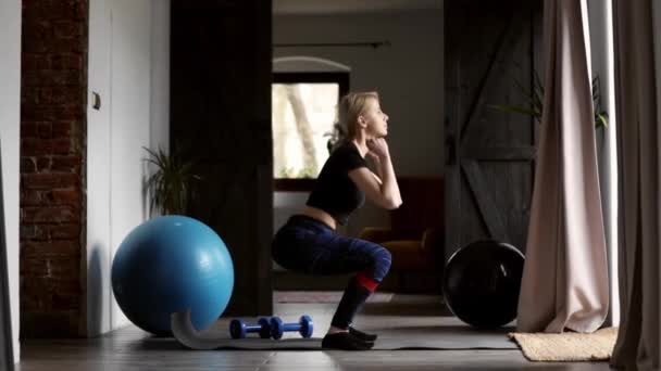 young woman doing sports exercises at home - Video