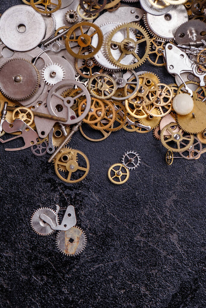 Details, technology. Heap of small gears on the table - Photo, Image