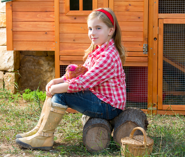 breeder hens kid girl rancher farmer with chicks in chicken coop - Фото, изображение