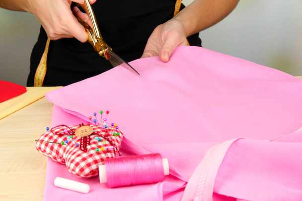 Cutting fabric with tailors scissors - Foto, Imagem