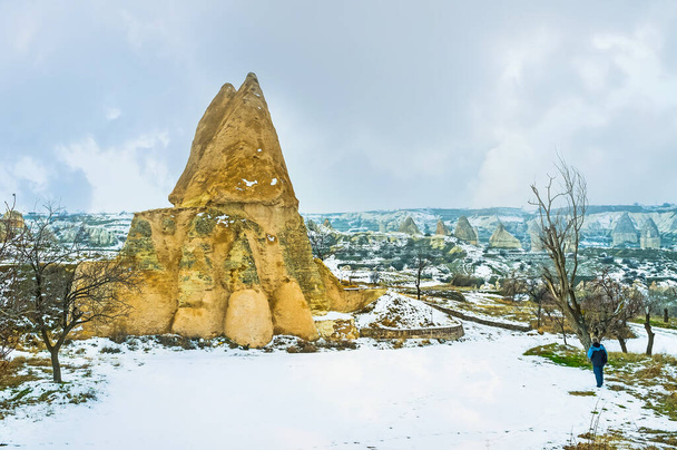The ancient rock church, named El Nazar Kilise or Evil Eye, located among the fairy chimney rock formations in valley of Goreme, Cappadocia, Turkey - Fotoğraf, Görsel