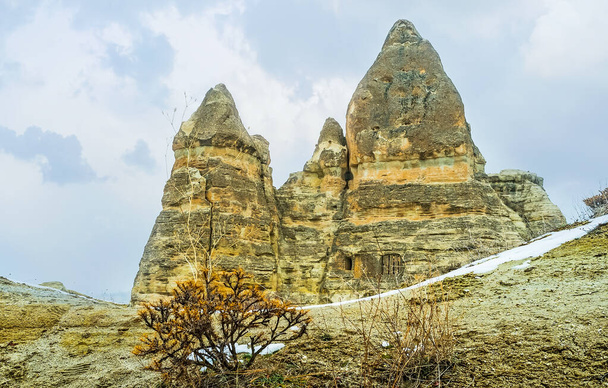 Cappadocian rocks with preserved cells, cut in them and remains of weathering, shaped these formations, Turkey - Zdjęcie, obraz