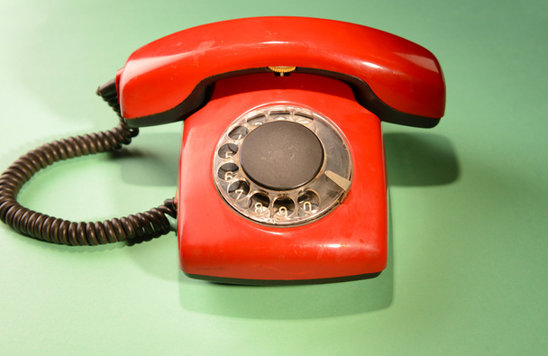 Red retro telephone,on color background - Фото, изображение