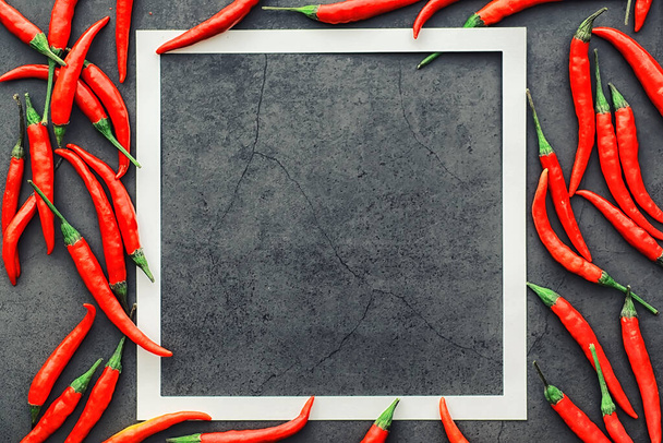 Hot red pepper. Chilean pepper on a black background. - 写真・画像