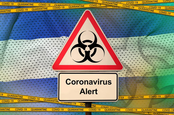 El Salvador flag and Covid-19 biohazard symbol with quarantine orange tape. Coronavirus or pandemic 2019-nCov virus concept - Photo, Image