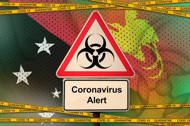 Papua Nová Guinea vlajka a Covid-19 biohazard symbol s karanténní oranžovou páskou. Coronavirus nebo pandemie 2019-nCov virus koncept - Fotografie, Obrázek