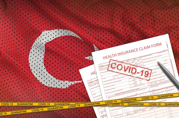 Turkey flag and Health insurance claim form with covid-19 stamp. Coronavirus or pandemic 2019-nCov virus concept - Photo, Image