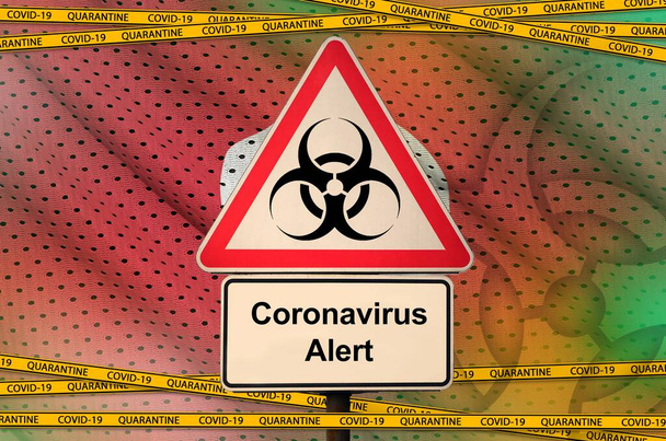 Tunisia flag and Covid-19 biohazard symbol with quarantine orange tape. Coronavirus or pandemic 2019-nCov virus concept - Photo, Image