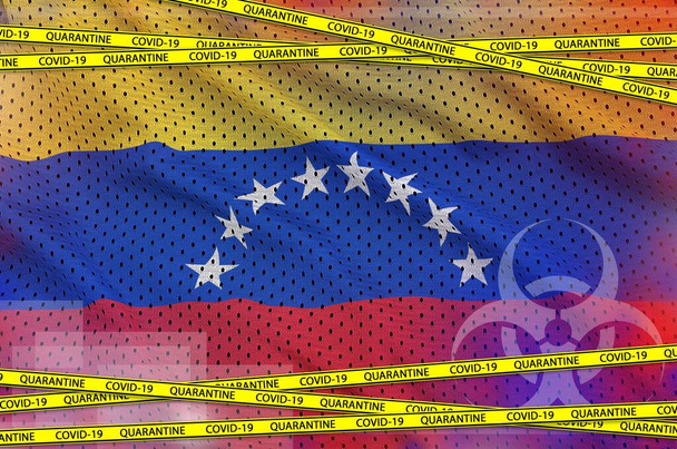 ベネズエラの国旗とCovid-19検疫黄色のテープ。コロナウイルスまたはパンデミック2019-nConvウイルスの概念 - 写真・画像