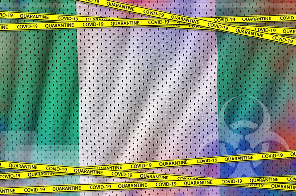 Nigeria flag and Covid-19 quarantine yellow tape. Coronavirus or pandemic 2019-nCov virus concept - Photo, Image