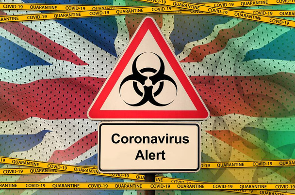 Velká britská vlajka a symbol Covid-19 biohazard s karanténní oranžovou páskou. Coronavirus nebo pandemie 2019-nCov virus koncept - Fotografie, Obrázek