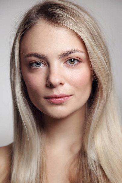 Portrait of young beautiful blonde girl with clean makeup - Foto, afbeelding