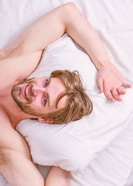 Get adequate and consistent amount of sleep every night. How much sleep you actually need. Bearded man sleeping face relaxing on pillow. Man handsome guy lay in bed. Expert tips on sleeping better - 写真・画像