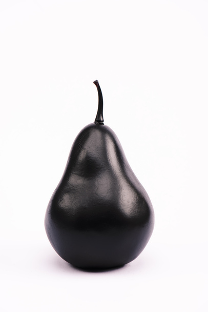 zwart en voedzame peer op wit met kopieerruimte  - Foto, afbeelding