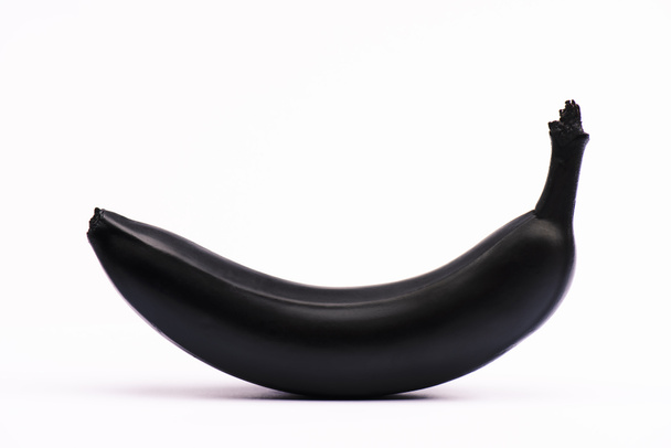 banana nera e nutriente su bianco con spazio di copia
  - Foto, immagini