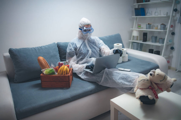 Quarantine and isolation during the virus outbreak - groceries and food in stock, working from home over the internet. - Photo, Image