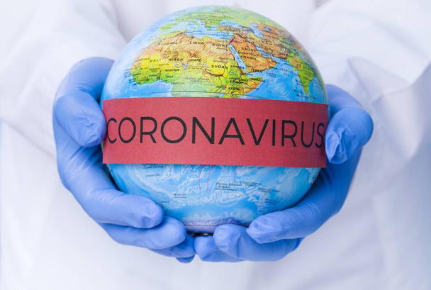 Coronavirus. Covid-19. Coronavirus Pandemic. Coronavirus2019. Earth with text concerning the Coronavirus Pandemic. - Фото, изображение