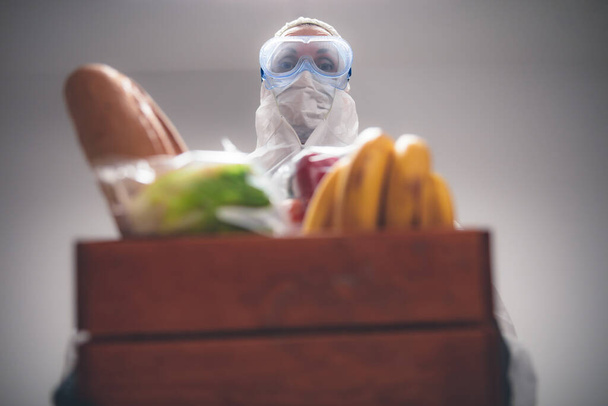 Food and groceries home delivery - quarantine and isolation during the virus outbreak. - Photo, Image