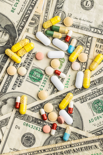 Pills and usa dollars money. Healthcare concept. Top view. - 写真・画像