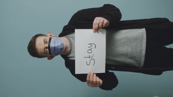 Young Man in Protective Mask Is Urging to Personal Responsibility - Materiał filmowy, wideo