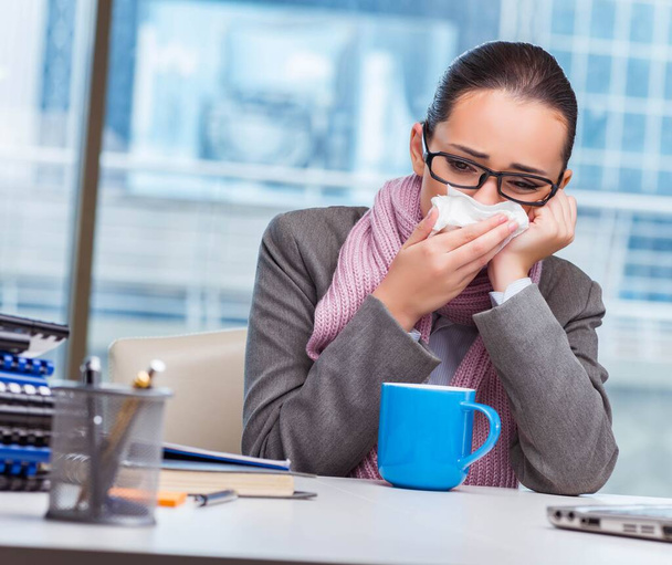 Young businesswoman sick in the office - Photo, Image
