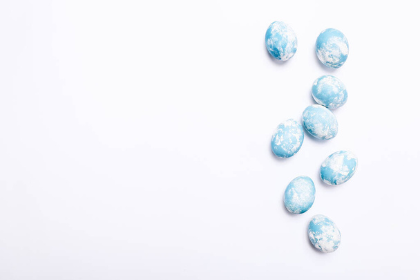 Stylish eggs with ombre blue marble stone effect on white background - Φωτογραφία, εικόνα