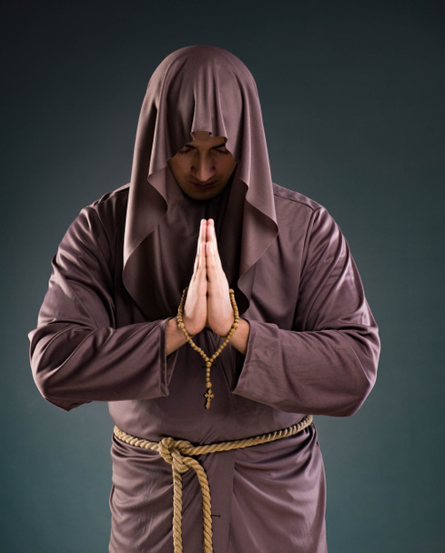 Monk in religious concept on gray background - Fotoğraf, Görsel