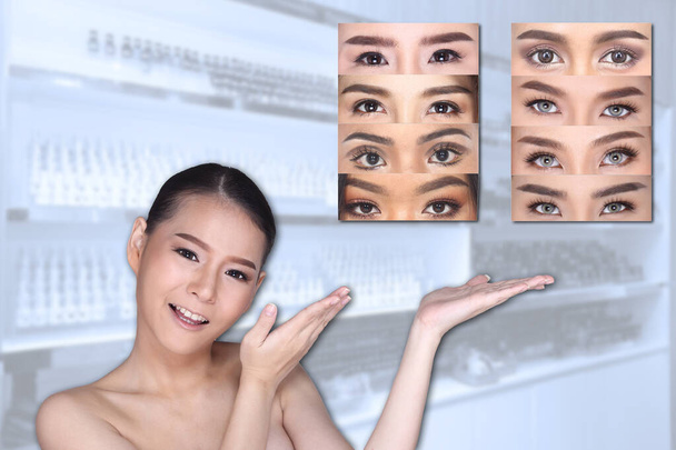 Young White Asian woman show empty copy space on the hand palm with clinic background, Concept Beauty Medical service permanent tattooing on eyebrow many style - Photo, Image