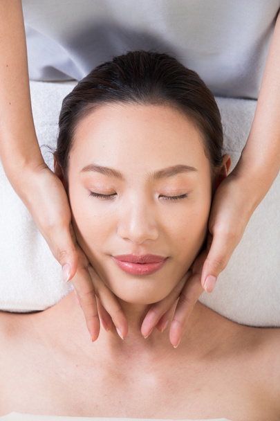 Ayurvedic Head Massage Therapy on facial forehead Master Chakra Point of Asian woman, Therapist Spa body woman hands treatment on customer to increase circulation release tension stress of think work - Photo, image