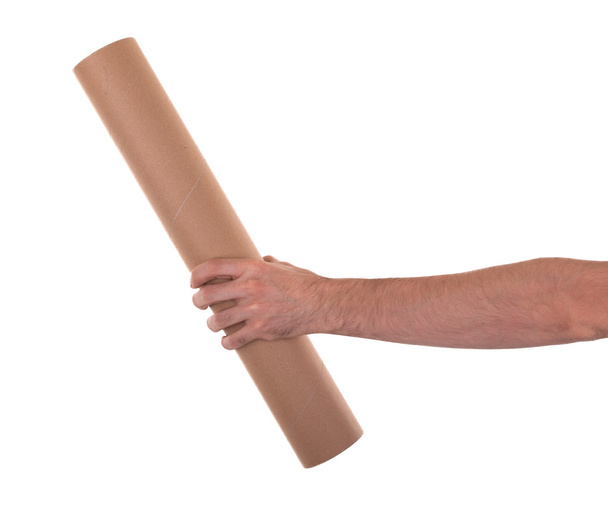 Крупним планом, рука тримає коричневий пакет
 - Фото, зображення