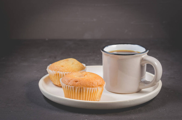 muffins and coffee for breakfast on a white tray - Фото, изображение