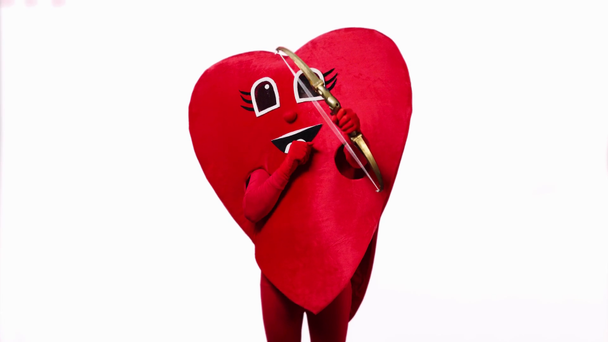 person in heart costume holding bow and arrow isolated on white - Footage, Video