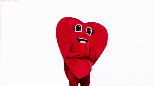 persona en traje de corazón tocando estómago aislado en blanco
 - Imágenes, Vídeo