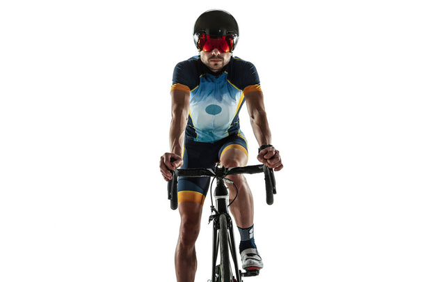 Triathlon male athlete cycle training isolated on white studio background - Foto, imagen