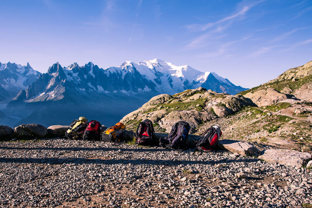Travelers Hiking Bags in front of Iconic Mont Blanc Snowy Peaks - Photo, Image