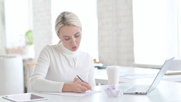 Paperwork by Young Businesswoman at Work - Photo, Image