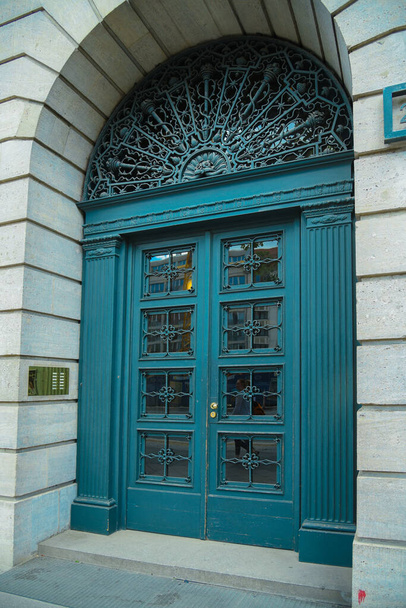 blue door in the urban environment  - Фото, зображення