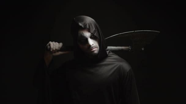 Grim reaper over black background with axe in his hands - Footage, Video