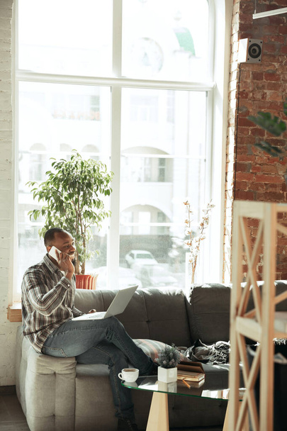 African-american man, freelancer during the work in home office while quarantine - Φωτογραφία, εικόνα