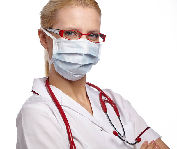 Woman doctor wearing medical anti virus mask. isolated studio portrait. - 写真・画像